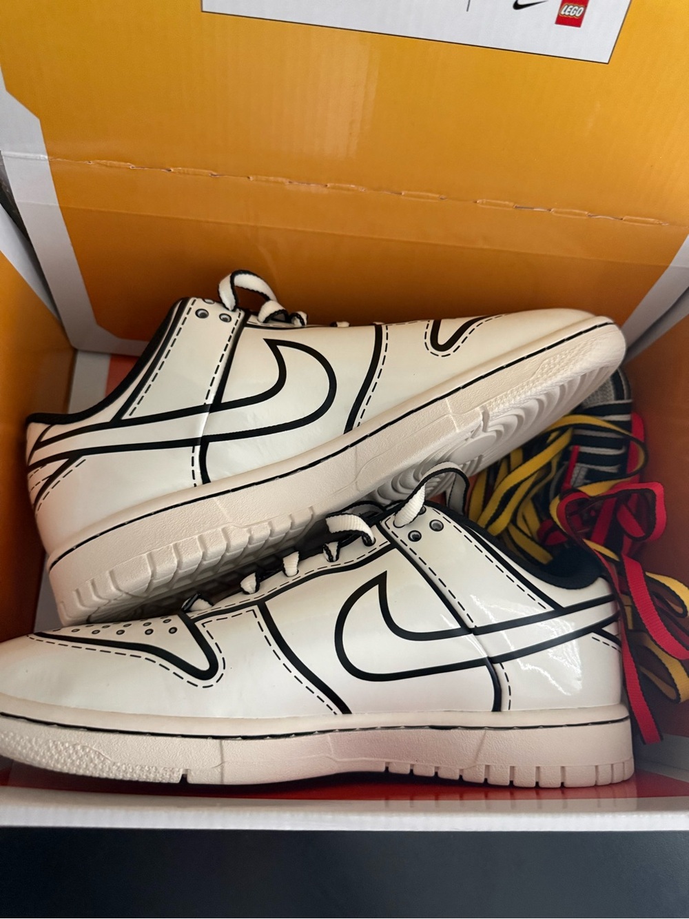 Nike Kids White Sneakers with Black Graphic Accents
